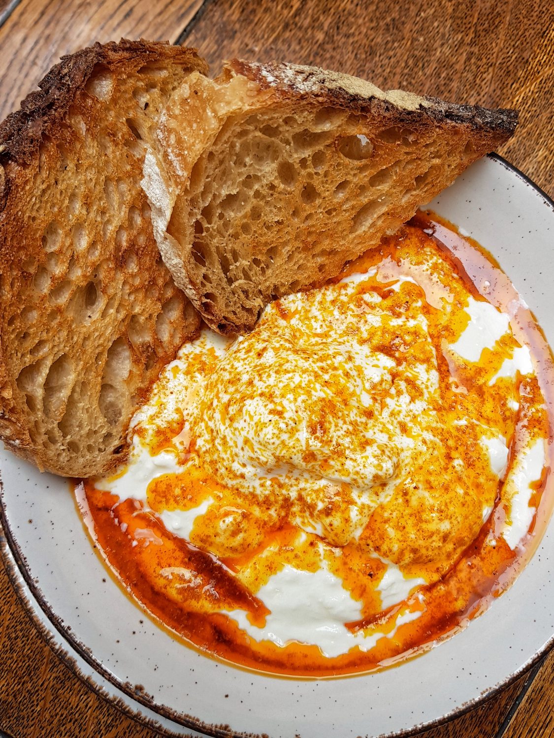 Çılbır aka Turkish style poached eggs with garlic yoghurt and peppered yoghurt